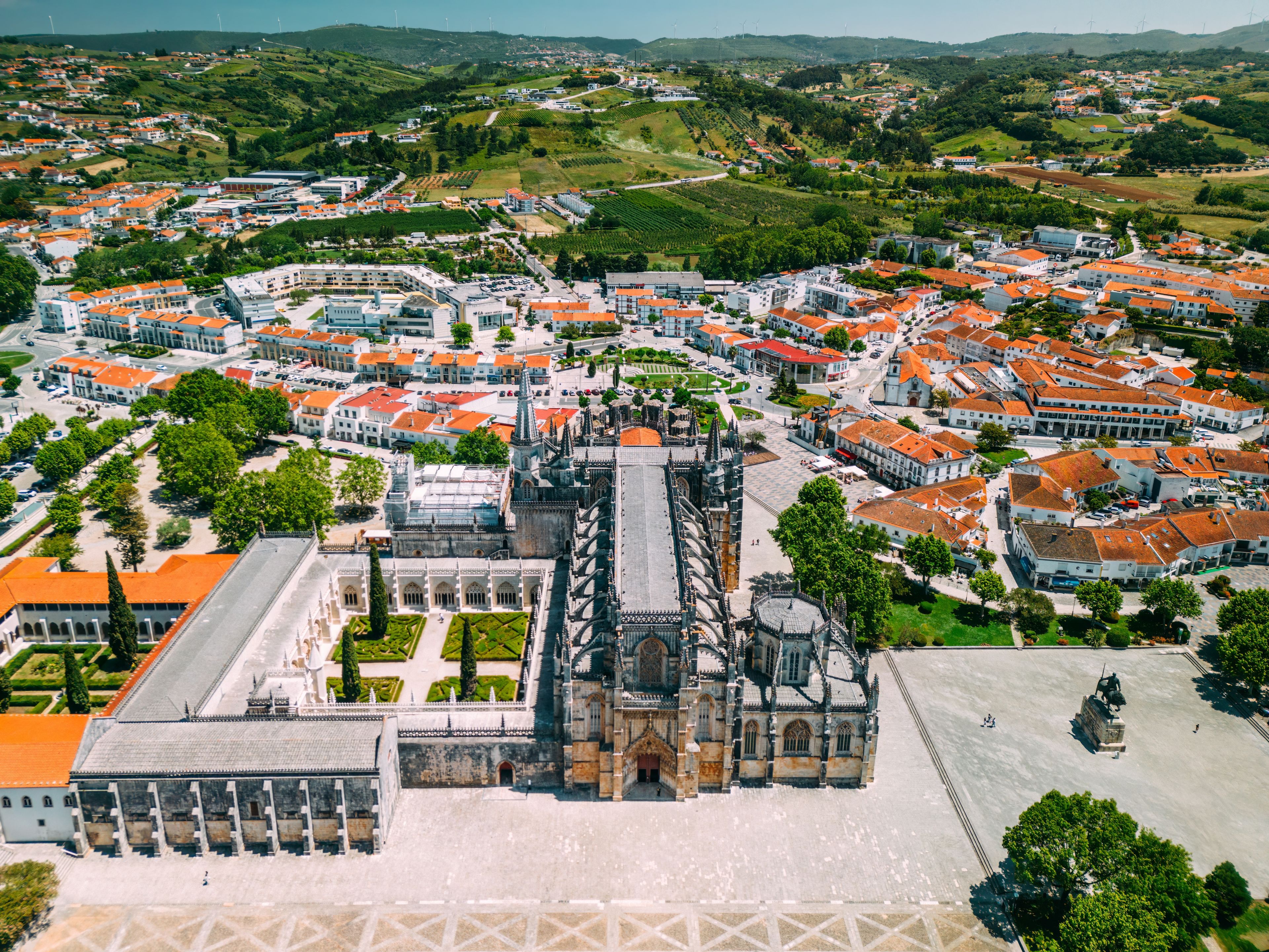 A panoramic view of a town with a prominent cathedral and surrounding residential buildings.