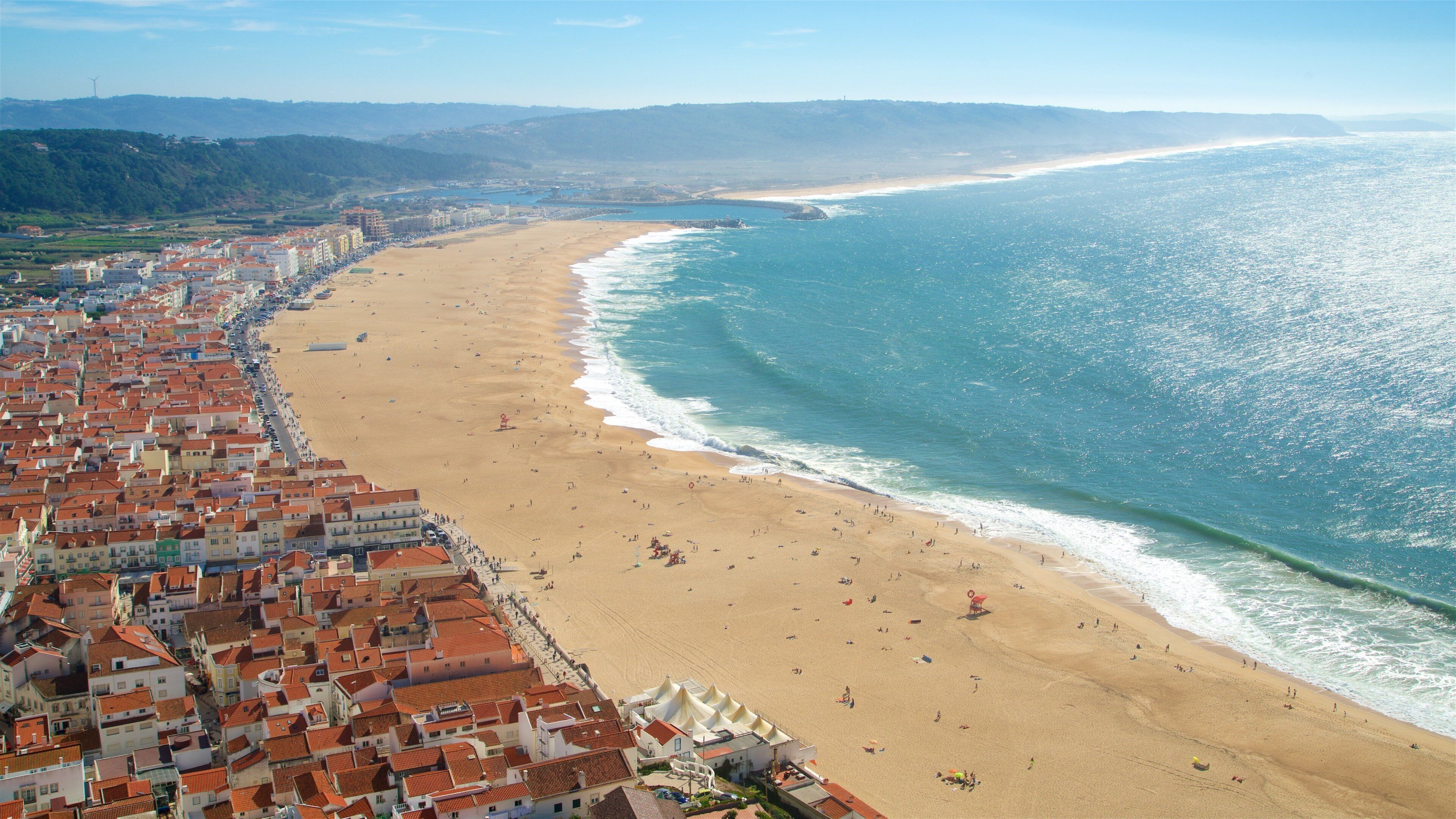 Nazare featuring general coastal views, a coastal town and a sandy beach