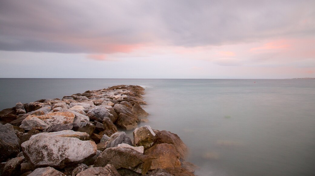 Malaga which includes rugged coastline, mist or fog and general coastal views