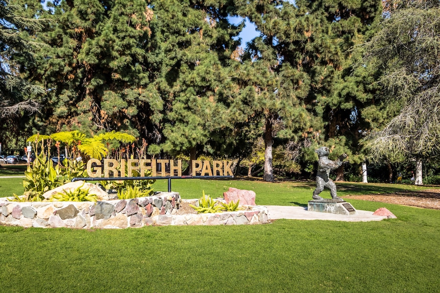 Griffith Park sign and bear statue - Los Angeles, California, USA
