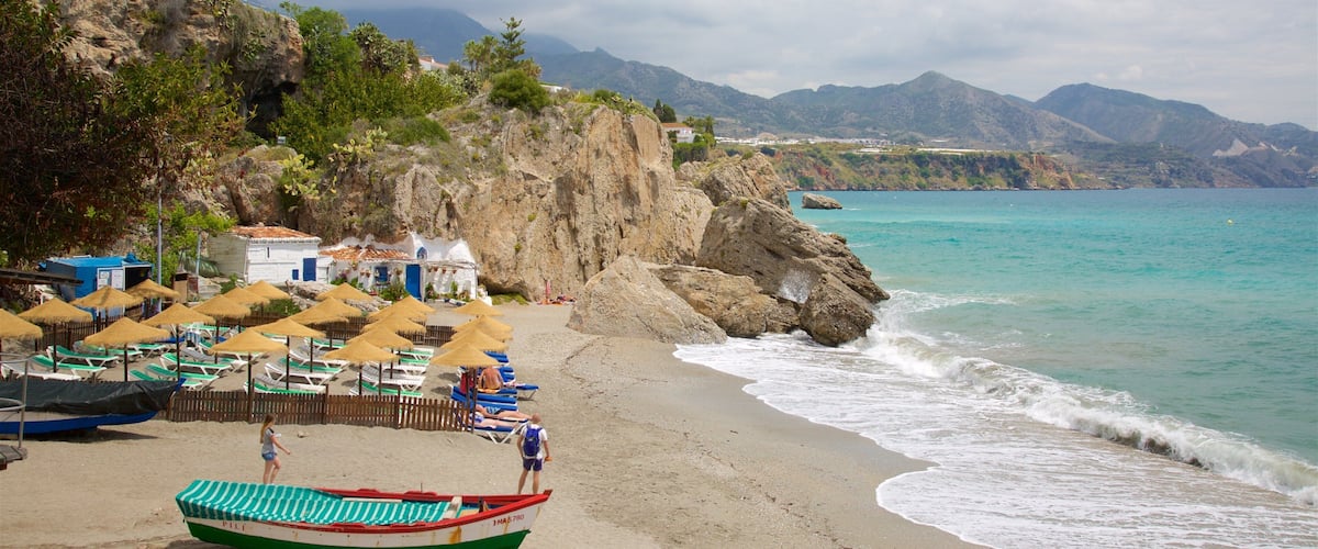 Nerja which includes general coastal views, boating and a sandy beach