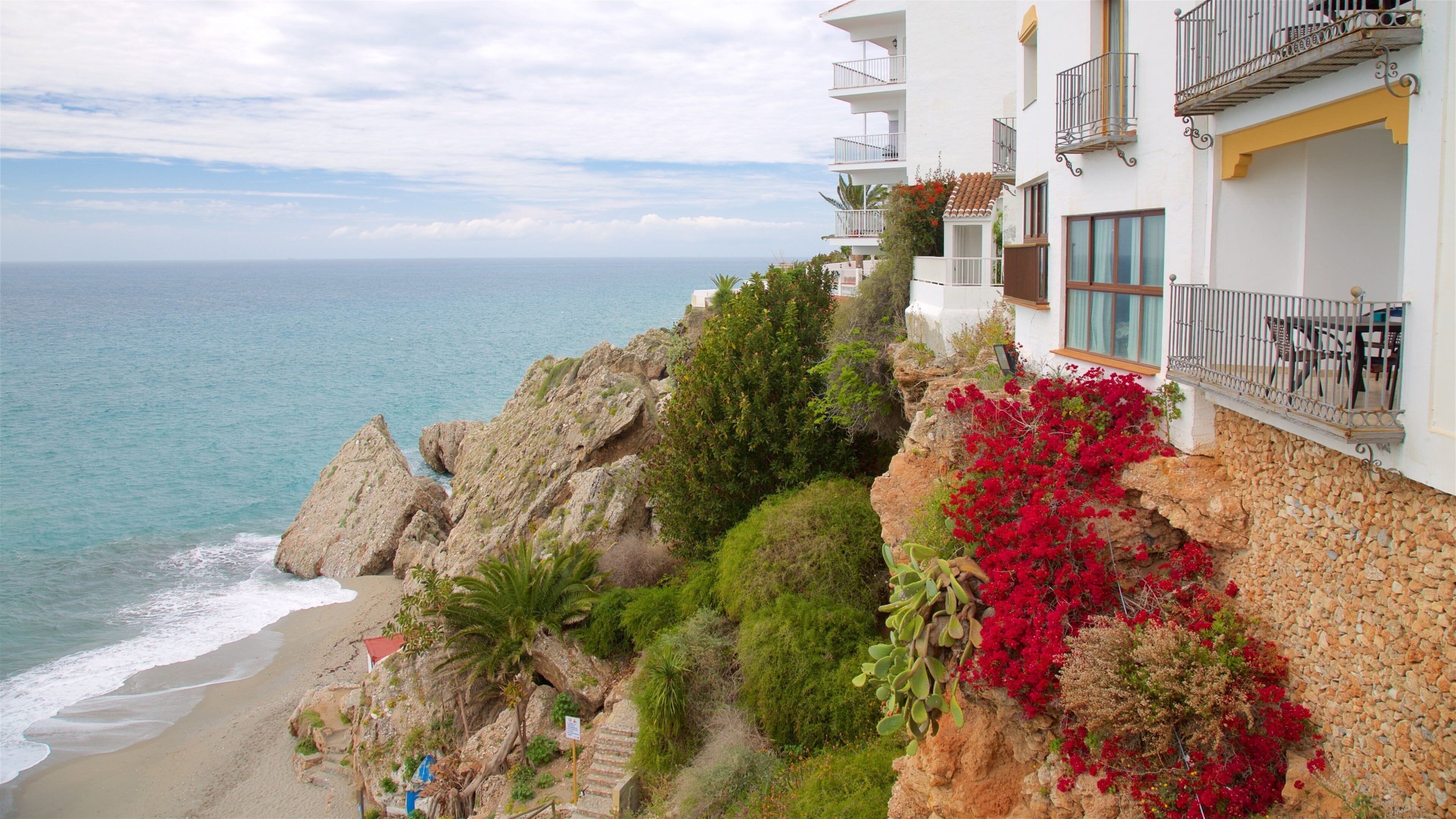 Nerja featuring general coastal views, a coastal town and a sandy beach