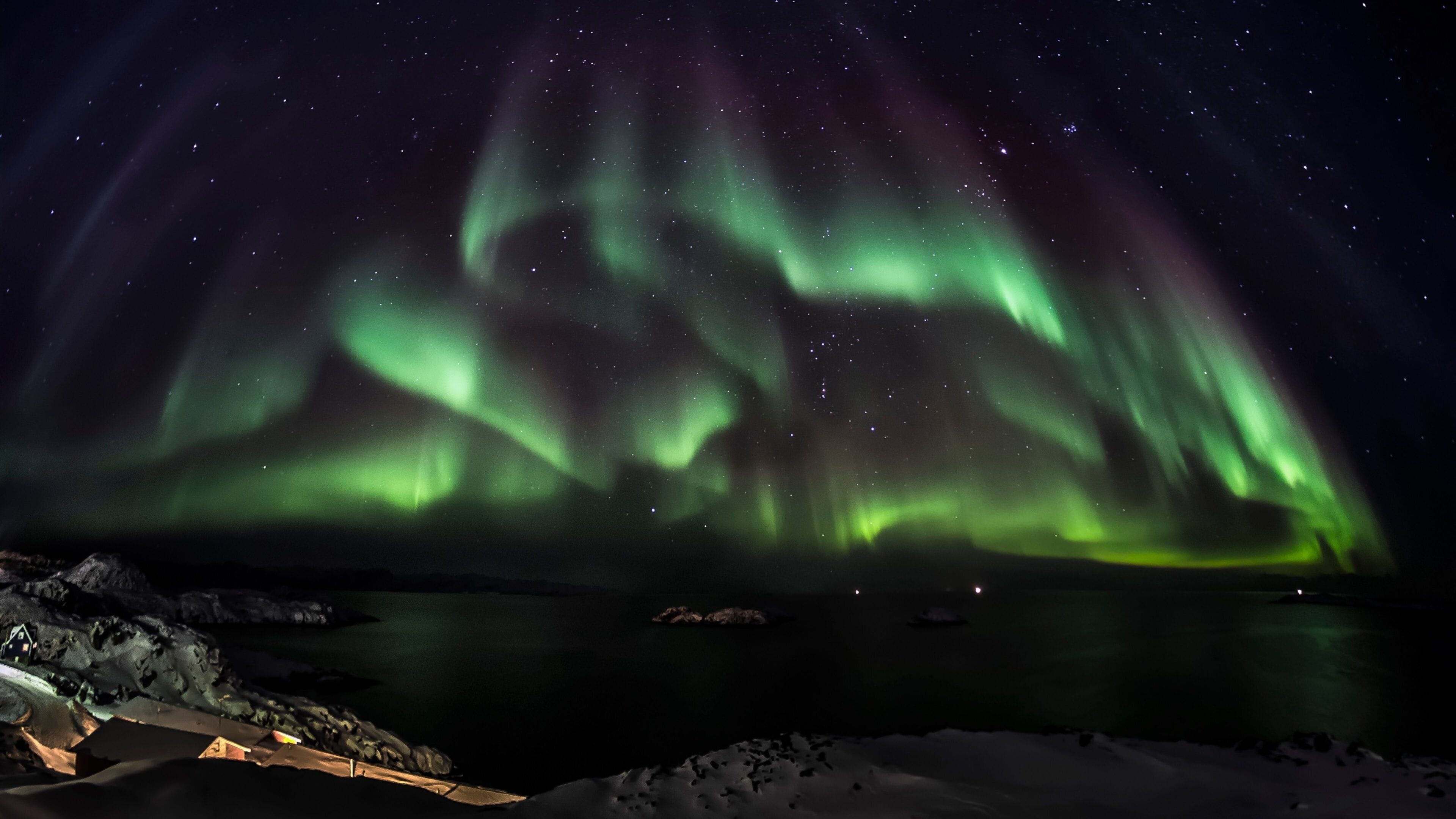 Greenland featuring northern lights and snow