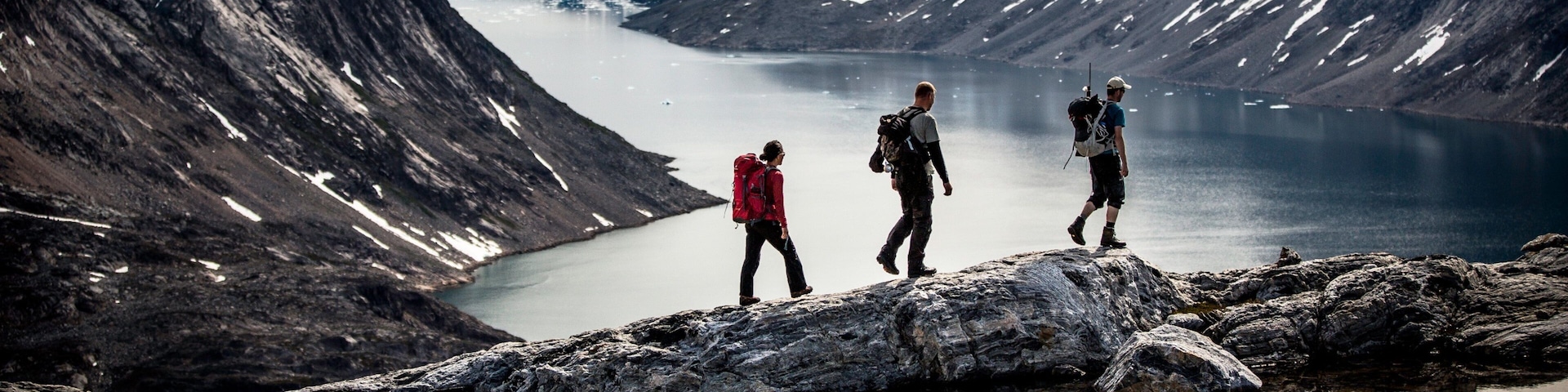 Greenland which includes snow, a lake or waterhole and hiking or walking
