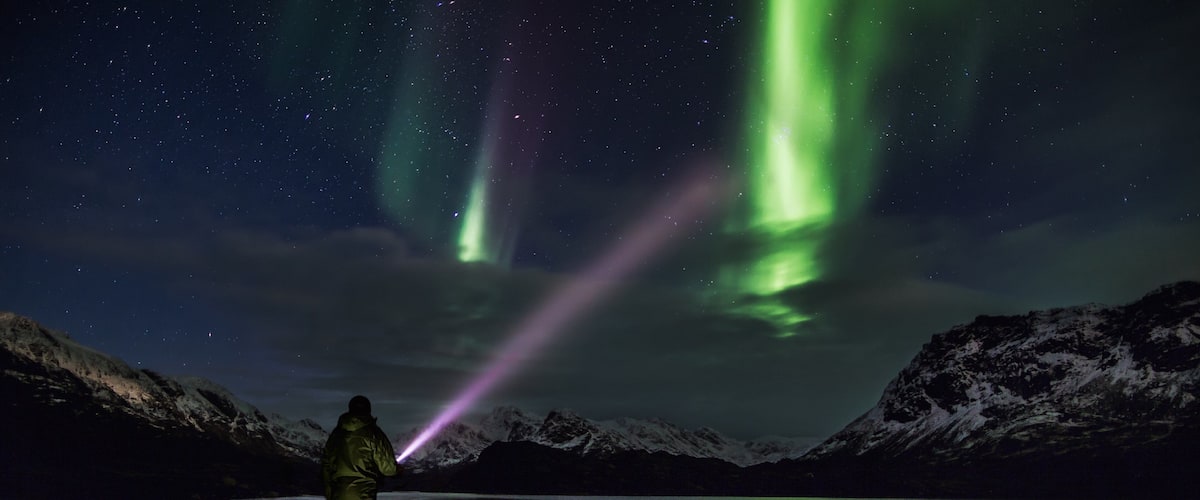 Greenland which includes a lake or waterhole, snow and mountains