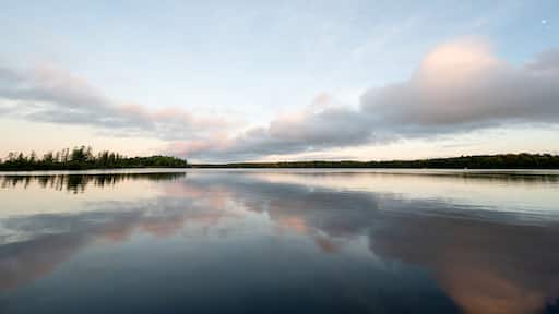 Peaceful warm summer sunrise over Pioneer Lake in Conover, Wisconsin
