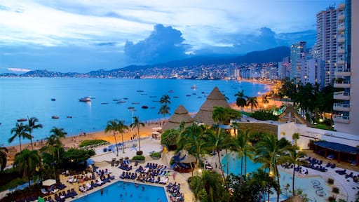 Mexico showing a pool, a city and general coastal views