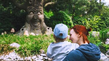 Family is having fun at amusement park Efteling, Netherlands.