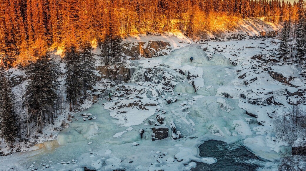 While at my B&B I was told of Cameron Falls. A "15 minute" hike 60 km from Yellowknife. The road out there is the road that leads to a ice road, the one used in Ice Road Truckers.
The hike was definitely longer than 15 minutes, even in summer I'd say it was about a 30 minute hike. But can you beat this view?! We got there and watched a couple guys climb the face of the falls. You can even walk around the river some and get to the other side of the waterfall.