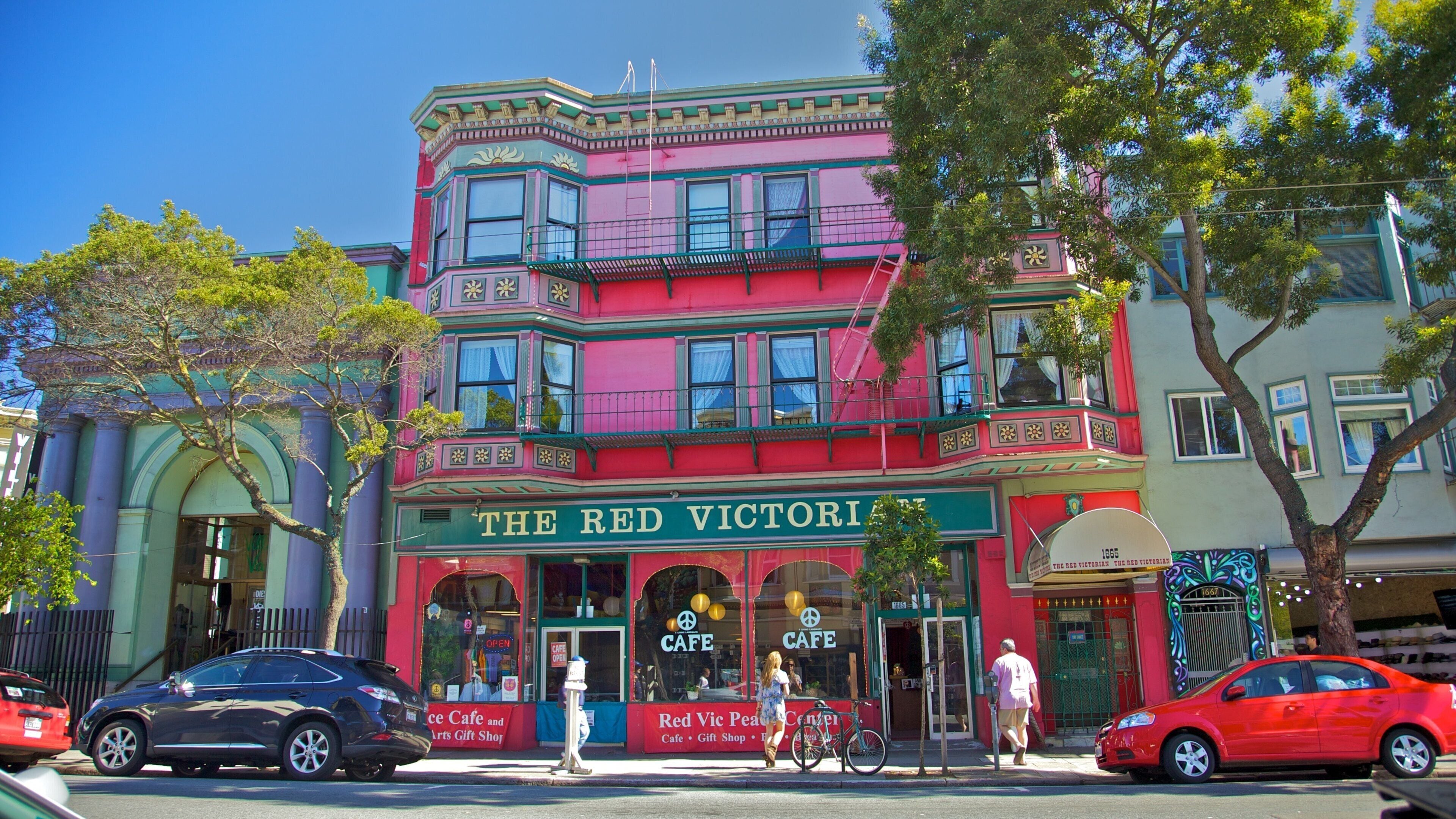 Distrito de Haight-Ashbury mostrando señalización, una casa y estilo de vida de café