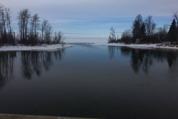 Beginning of March! Ice still on the main lake and we are still on snow machines, Cold river starting to open up more. (Never does freeze tho!)