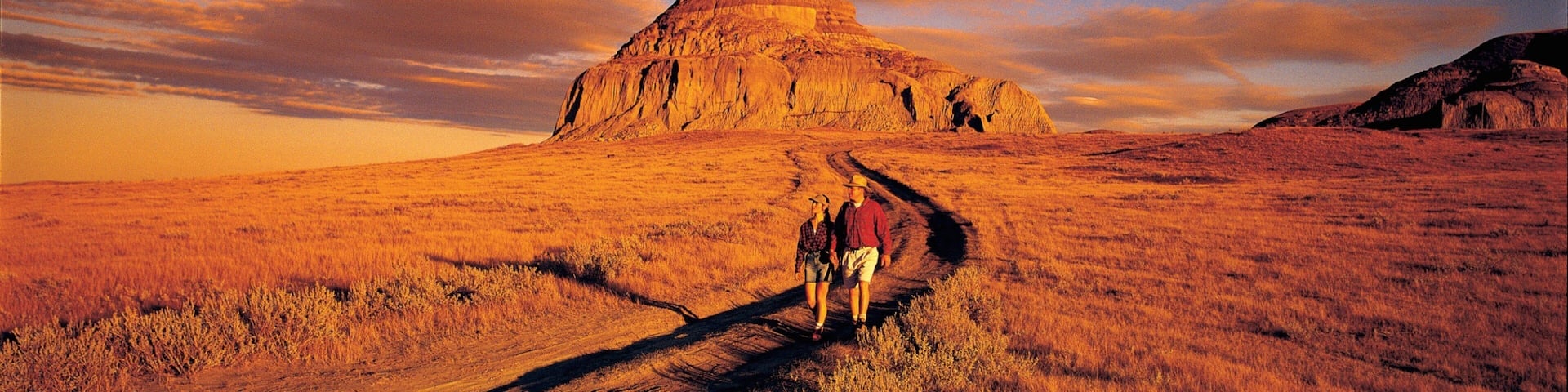 Saskatchewan showing tranquil scenes, a sunset and hiking or walking