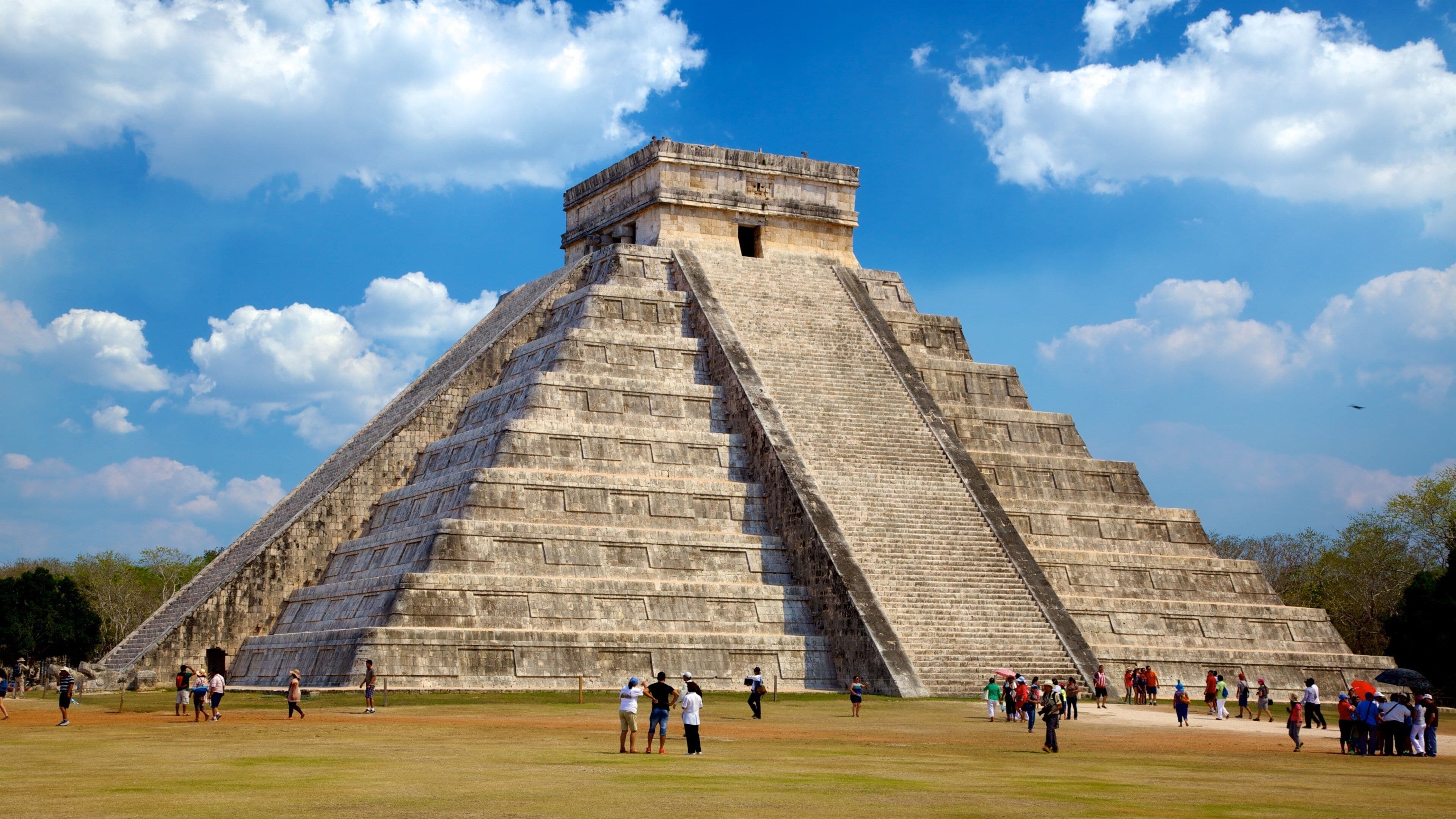 Mexico featuring building ruins and a temple or place of worship as well as a large group of people