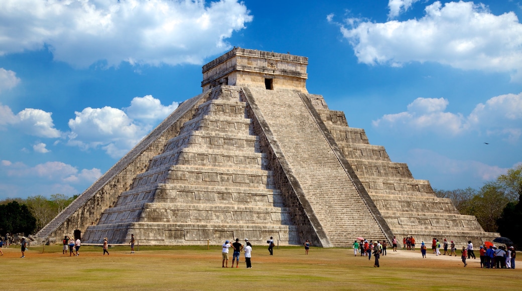 Mexico featuring building ruins and a temple or place of worship as well as a large group of people