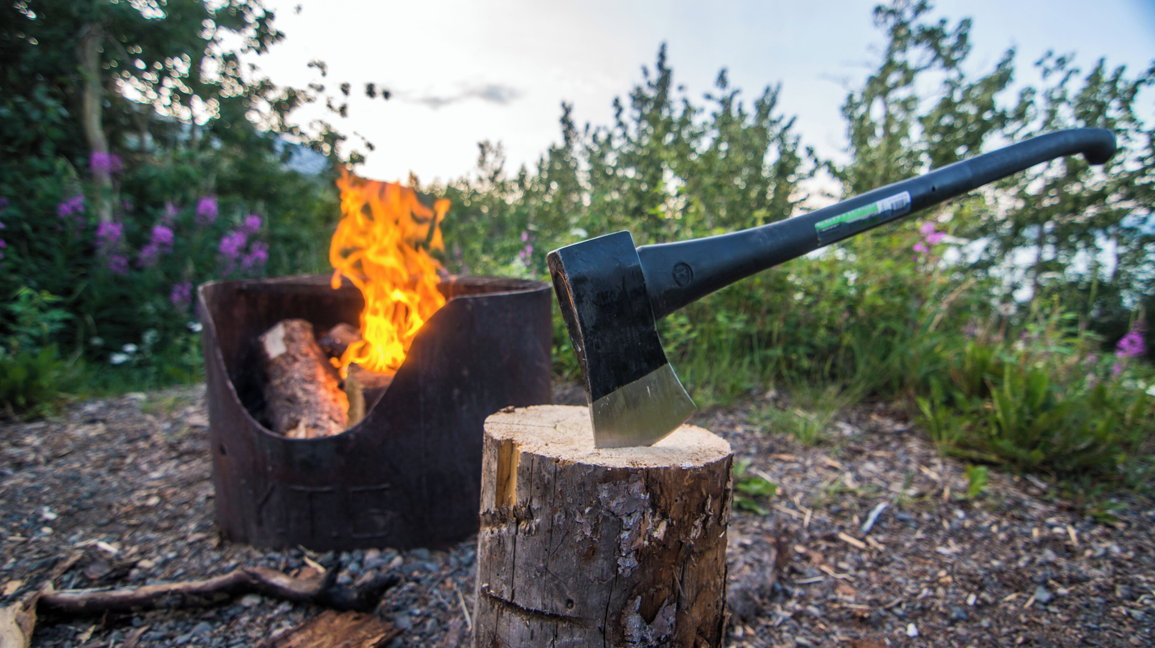 Nothing like a blazing fire after chopping wood. enjoying the wonders of nature in The Yukon is capped off with a few flames and stories among friends. #Adventure