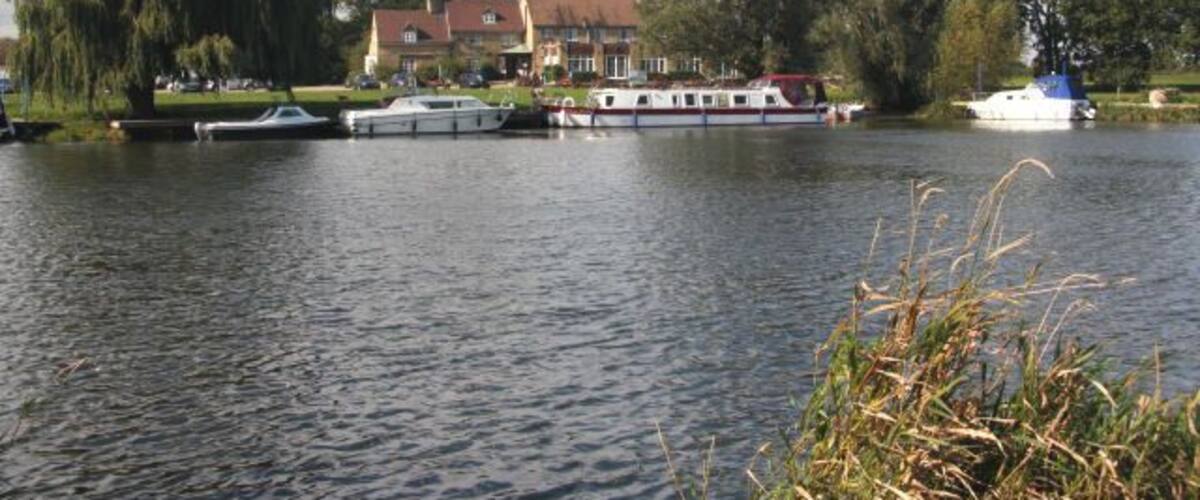 The Pike and Eel pub at Overcote Viewed from the eastern bank of the River Great Ouse, this pub and the adjacent marina are popular with boating folk.