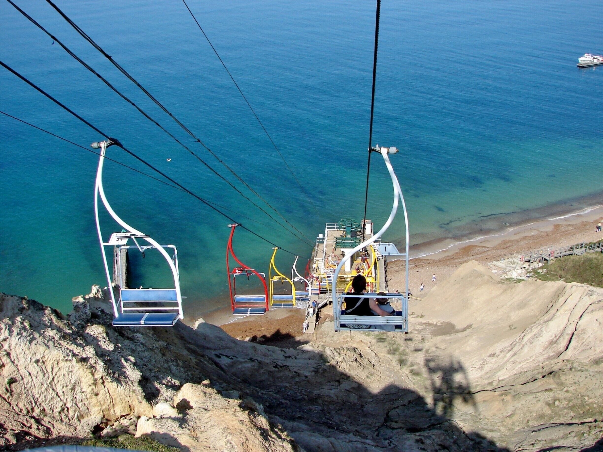 The Needles lie just to the southwest of Alum Bay, and are a tourist draw. Scenic boat trips operating from Alum Bay that offer close-up views of the Needles. The rocks and lighthouse have become icons of the Isle of Wight, and are featured on many of the souvenirs sold throughout the island.[citation needed]

The main tourist attractions of the headland itself are the two gun batteries, the experimental rocket testing station, and the four Coastguard cottages owned by the National Trust.[citation needed]

A branch of the National Coastwatch Institution is also based at the Needles, sited near the New Battery and Rocket Testing Site on High Down.

The Needles – Landmark Attraction (previously known as The Needles Pleasure Park) situated at the top of the cliff at Alum Bay is a small amusement park. A Chairlift operates between the park and th