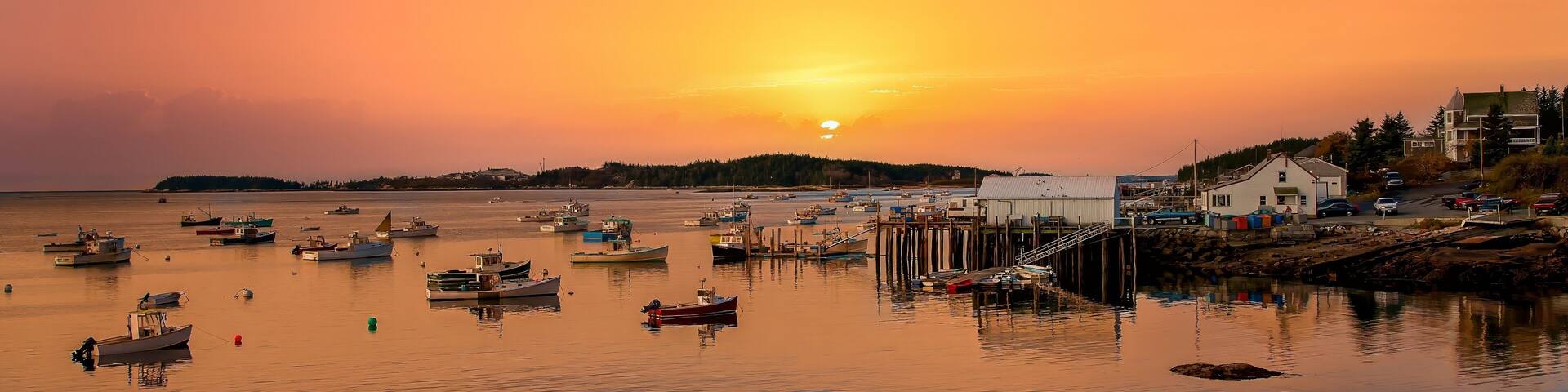 Stonington, Maine - 10/26/2006: A cloudy day at Stonington Bay, with boats anchored in the harbor.