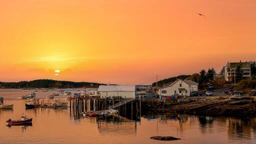 Stonington, Maine - 10/26/2006: A cloudy day at Stonington Bay, with boats anchored in the harbor.