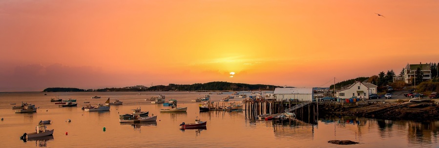 Stonington, Maine - 10/26/2006: A cloudy day at Stonington Bay, with boats anchored in the harbor.