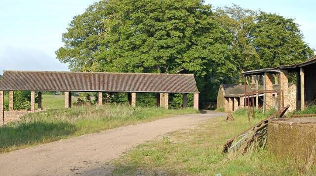 Larennie Farm. The large open sided build on the right was posh silage pit in its day. General view from the west looking out towards Peat Inn