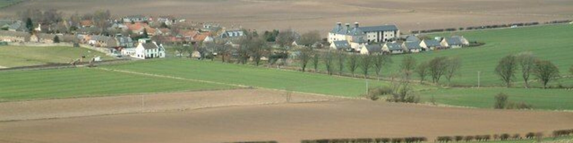 Pitlessie The village seen from Cults Hill. The former maltings are easy to identify towards the right of the photograph, and the white village inn stands out to the left.