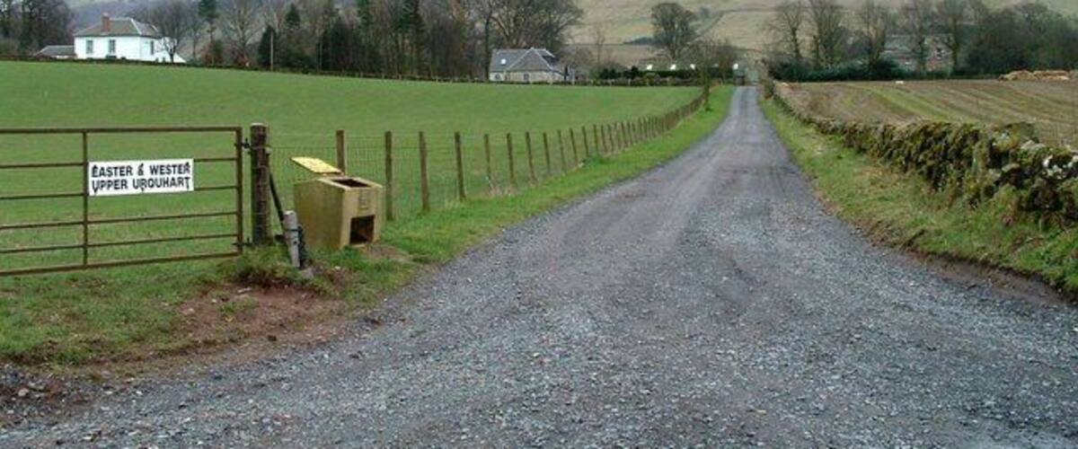 A rural road leading to a gate labeled 'Easter & Wester Upper Urquhart'.