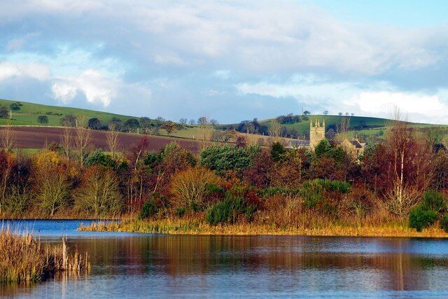 Birnie Loch Disused gravel pit near Colessie, whose church can be seen in the background, it is now a haven for waterfowl