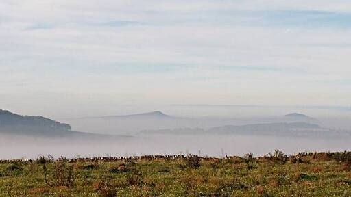 The Lomonds. A view from the high ground above Pitcullo looking west towards the Lomonds several Kms away on a day when the sea harr has moved far inland leaving just the high ground of East Fife above the mist and in brilliant sunshine whilst the rest of the land shivers in near zero temperatures.
