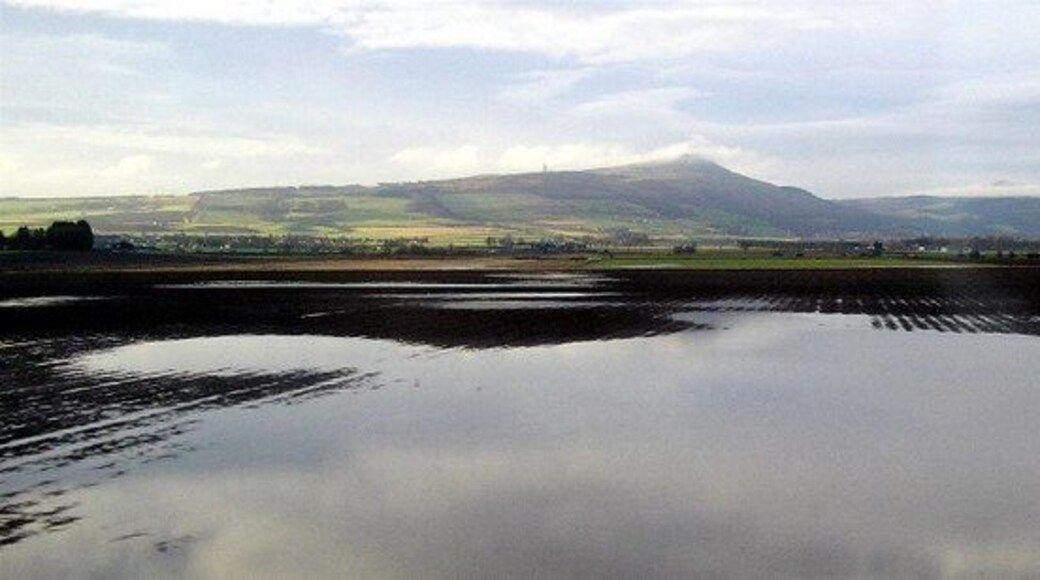 Flooded fields Flooded fields following heavy January rain in the foreground, with the Lomond hills in the background. Taken from the train with the village of Freuchie disappearing to the left.