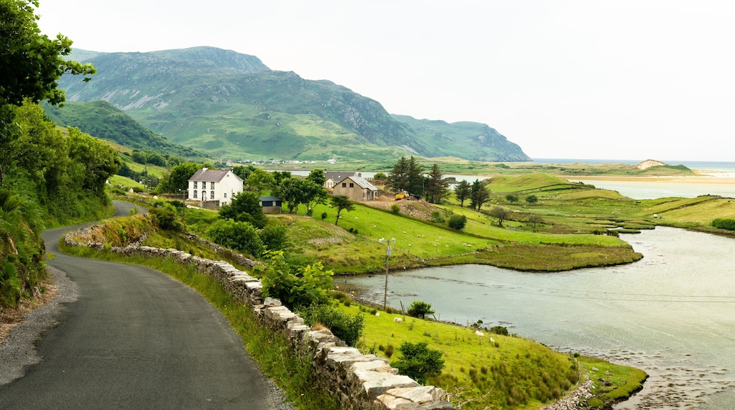 Panorama. View of the Atlantic ocean beach, mountains, village.