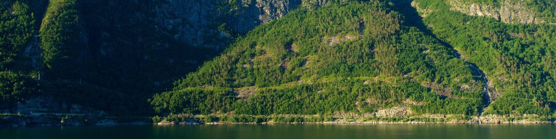 Eidfjord which includes a river or creek and mountains