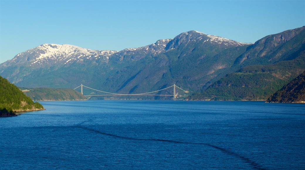 Eidfjord showing mountains, a river or creek and a bridge