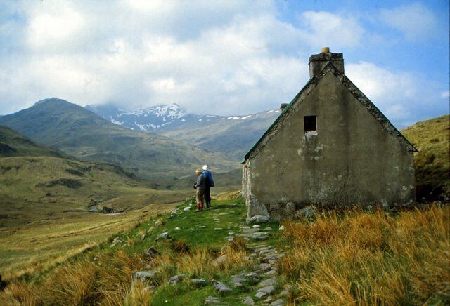 Camban Bothy in 1983 I remember that it was in good condition inside and thinking I'd like to make use of it at some point in the future, unfortunately, as yet I haven't done so. The picture of the bothy on the Mountain Bothies Association website suggests that it has recently been reroofed (in a rather garish red)and the window pictured in the gable end has been bricked in. The cloud topped peak in the distance is Sgurr a' Bhealaich Dheirg, one of the line of peaks on the north side of Glen Sheil