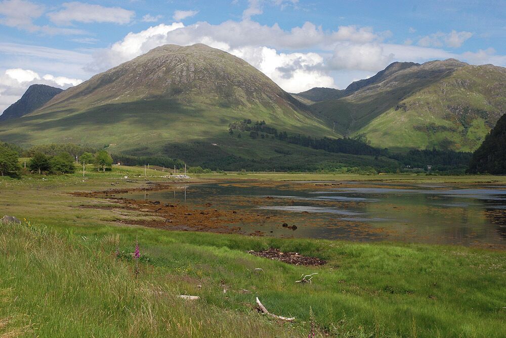 The head of Loch Long Water gradually giving way to salt marsh. Ben Killilan and Sguman Coinntich form the backdrop.