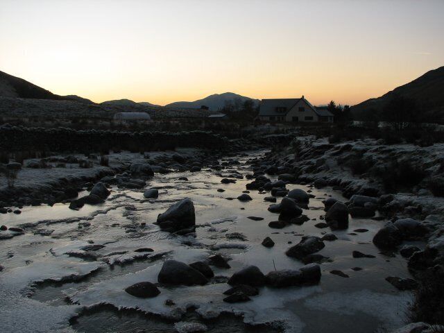 River Glennan In a valley sheltered from the winter sun the River Glennan has become largely frozen after a period of very cold weather.