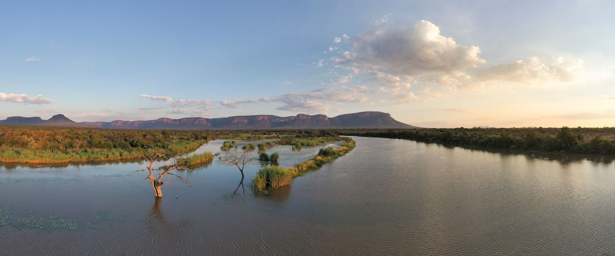 Aerial view of serene river and majestic mountains, Lephalale NU, South Africa.