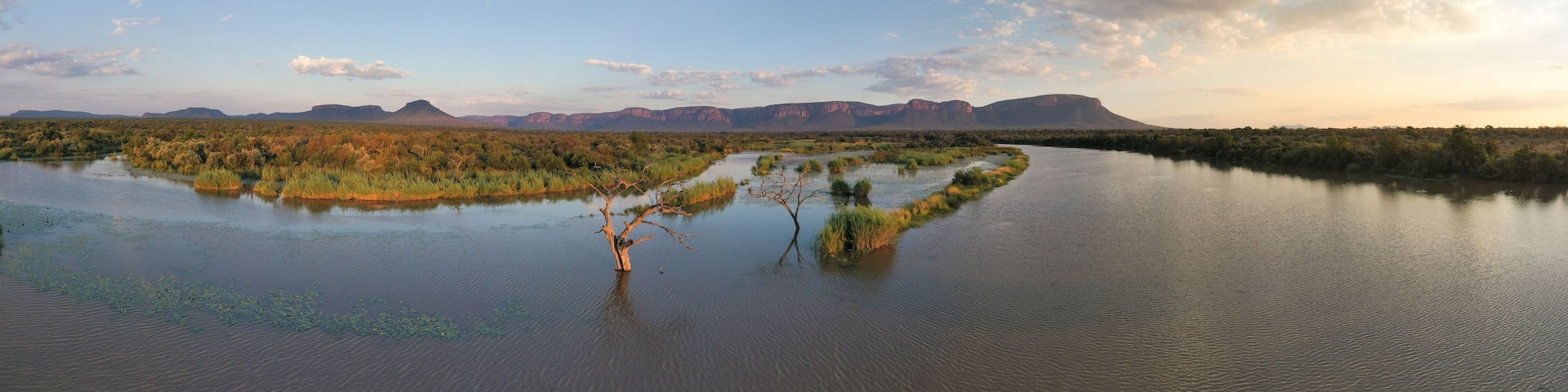 Aerial view of serene river and majestic mountains, Lephalale NU, South Africa.