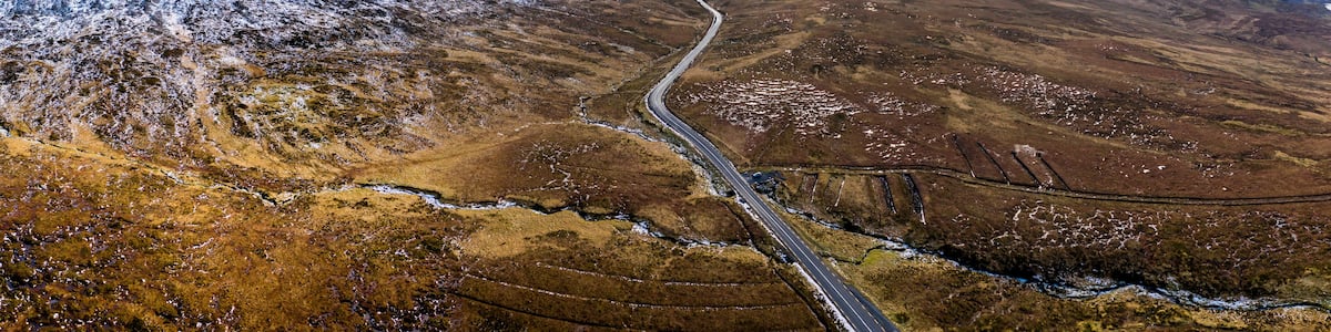 Aerial of the R251 Highway close to Mount Errigal, the highest mountain in Donegal - Ireland