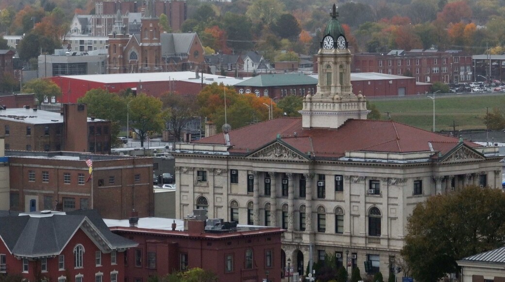 Downtown Elmira, NY Aerial of city under cloudy sky with streets and business with historic architecture under cloudy sky with low fog on landscape