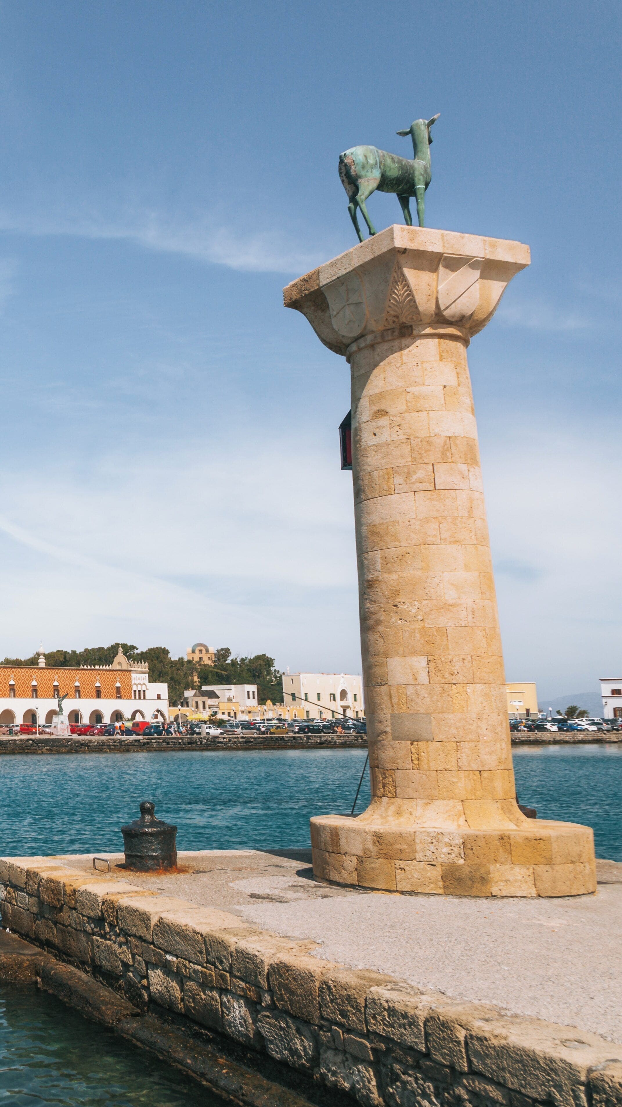 Exploring Harbour Gates in Rhodes, South Aegean, Greece with a Statue of a Deer on a Column