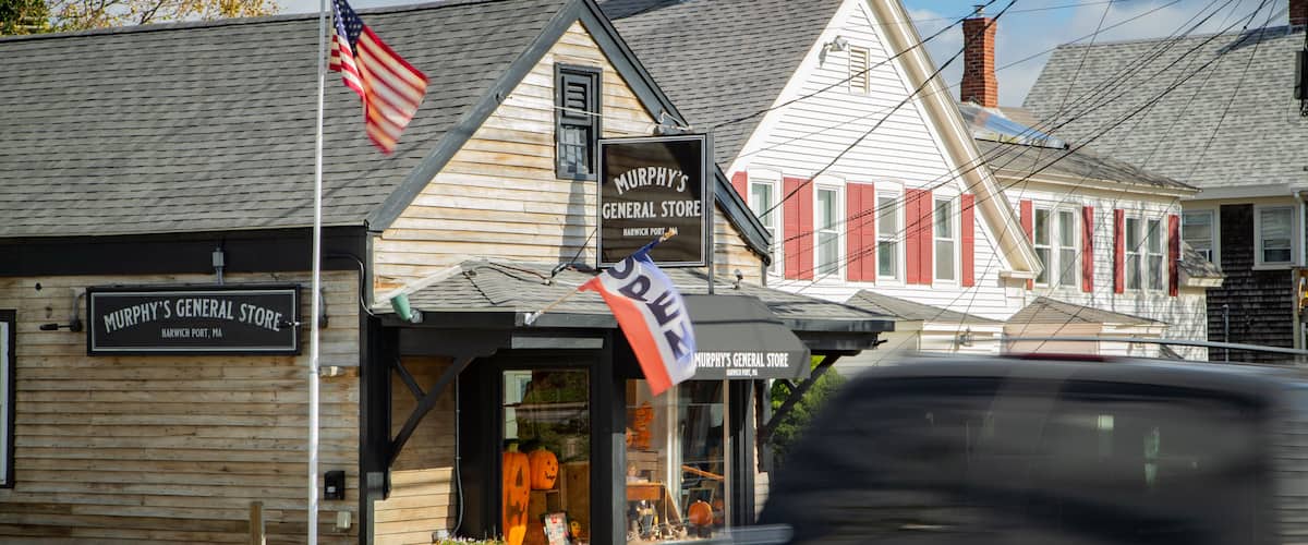 A wooden building with a sign reading "Murphy's General Store" in Harwich, MA.