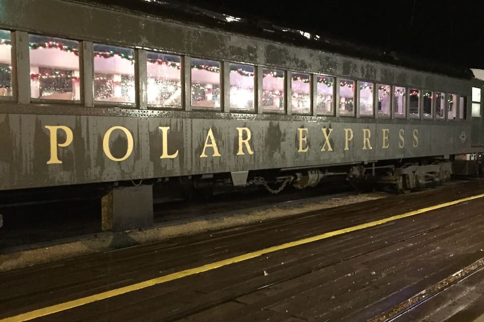A POLAR EXPRESS train at a station platform.