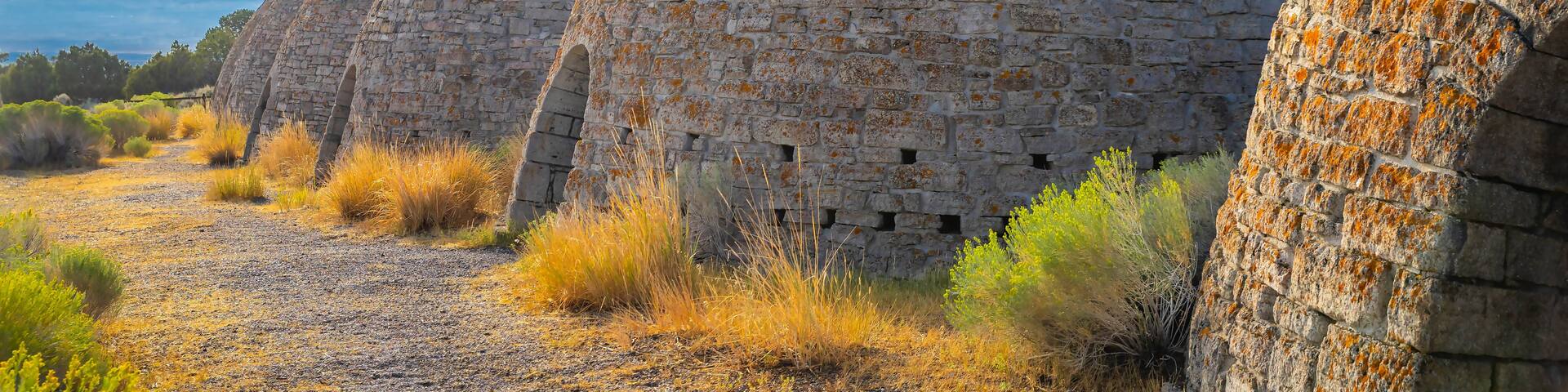 Historic trail past stone Ward Charcoal Ovens at sunset
