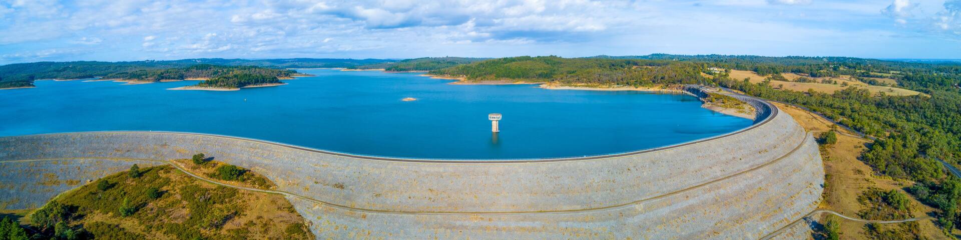Aerial panorama of Cardinia Reservoir lake and dam wall