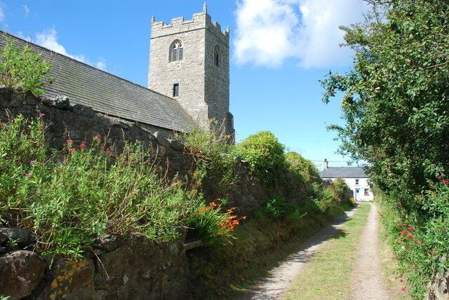 A stone wall, a narrow path, and a tower.