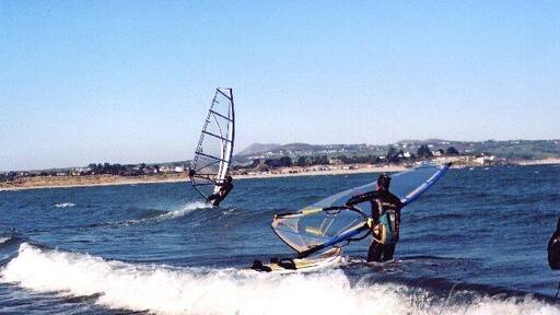 Windsurfers near Penrhyn Du. Taken to the east of Penrhyn Du headland (The wind was NE) Looking NW towards Abersoch Main Beach