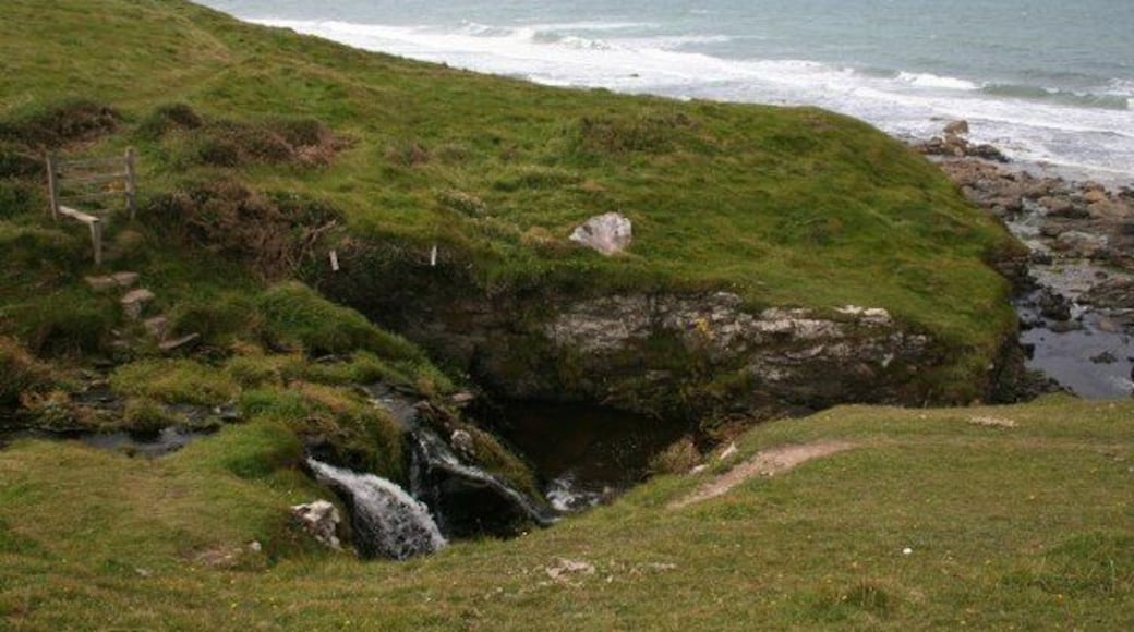 Coastal waterfall Small waterfalls on this unnamed coastal stream are marked on the 1:25000 OS map. The magnificent north coast of Llŷn stretches away beyond, the path here going up steps to a very rickety stile.