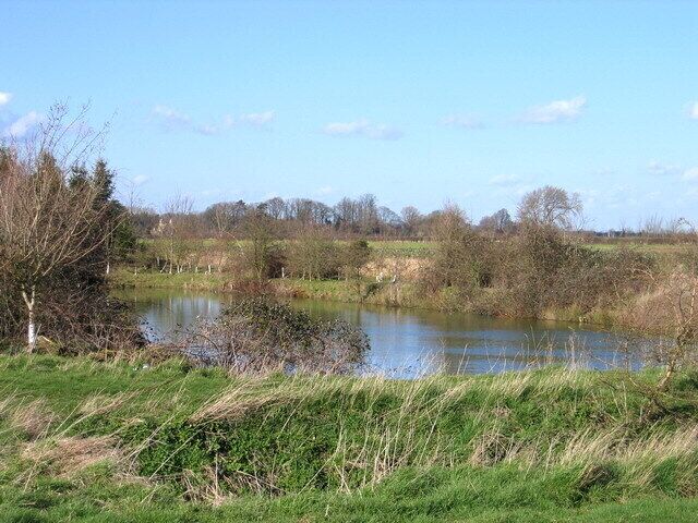 Small Pond off Farm track Gatehouse to Casewick Park in the distance