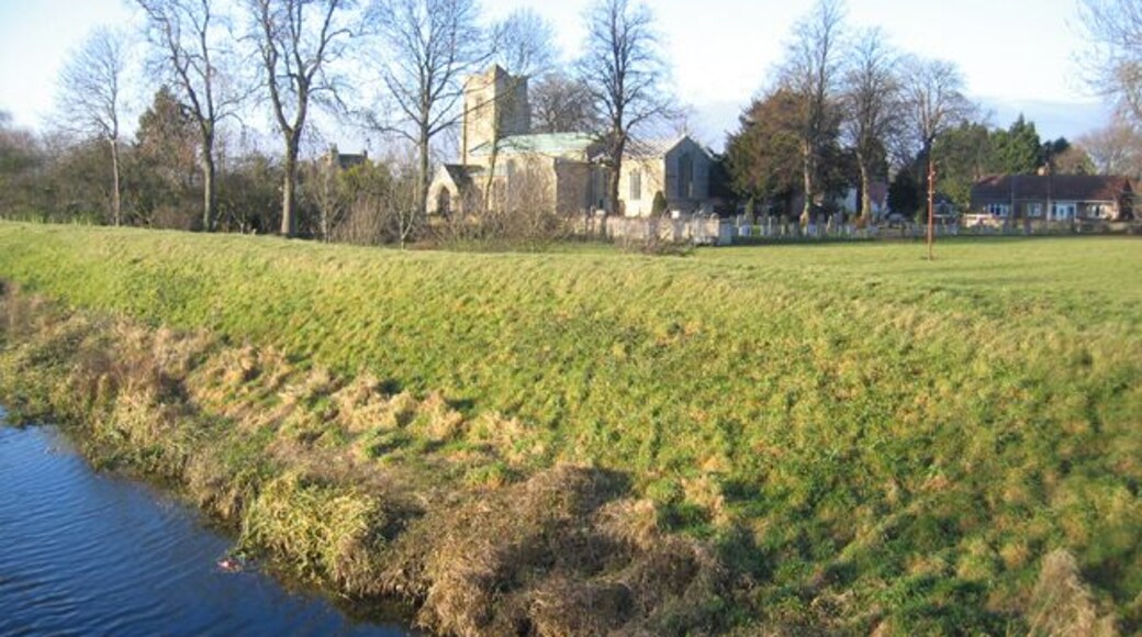 Tallington parish church, Lincs. Dedicated to St Lawrence; the tower is 14th C and the nave arcades and transepts are primarily 13th C http://www.crsbi.ac.uk/ed/li/talli/ . View NW from the bridge over the Maxey Cut.